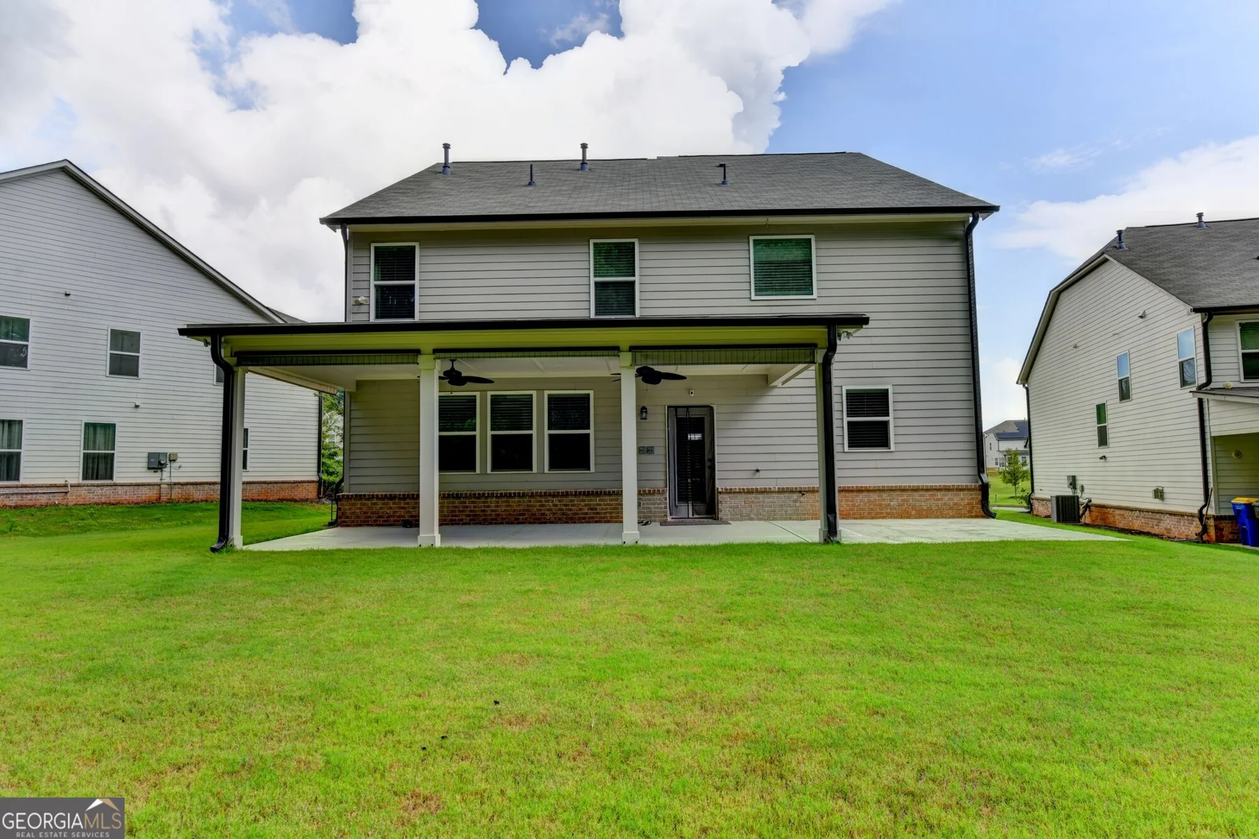 Rear exterior, covered patio and backyard