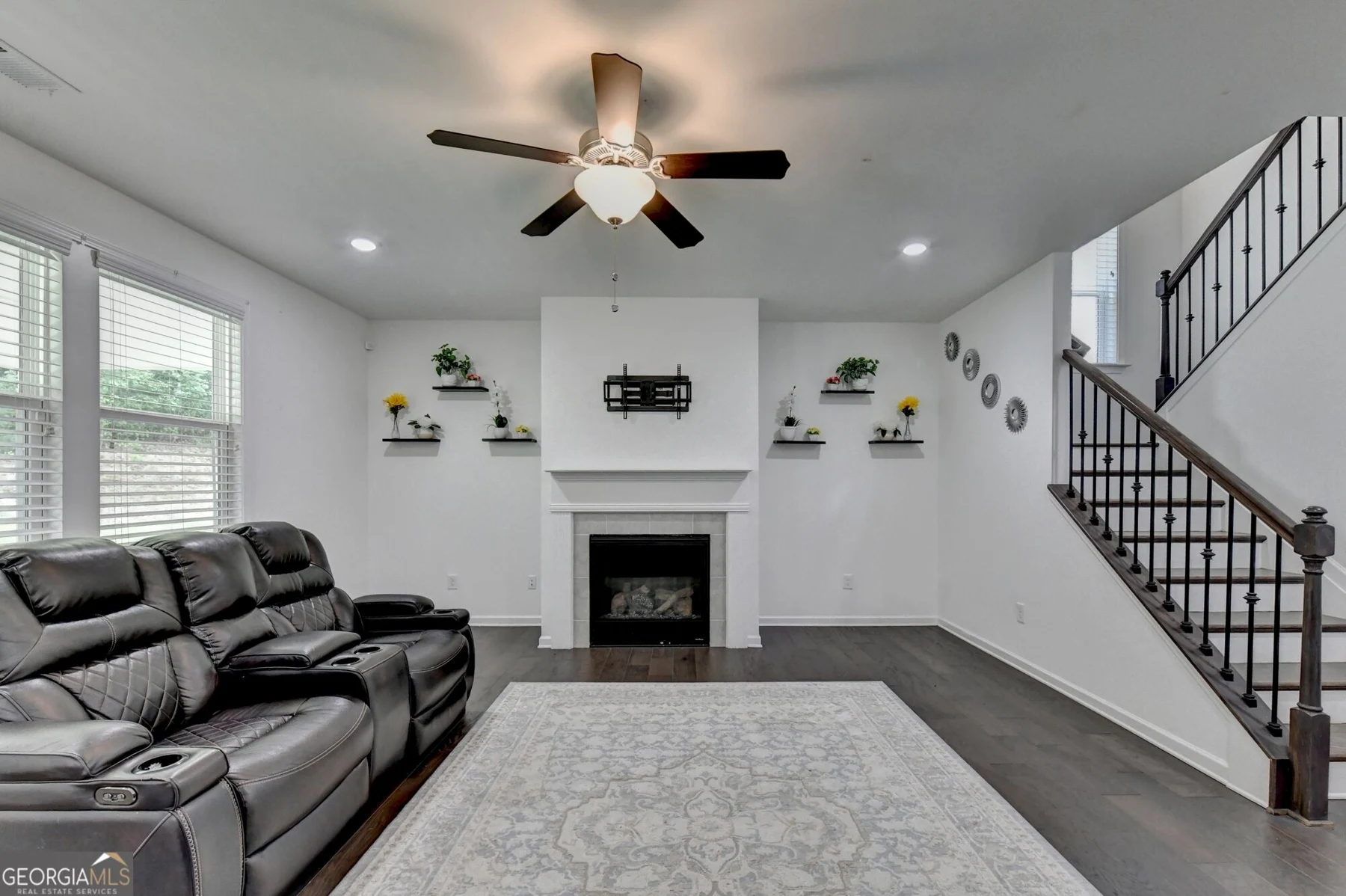 Family room with fireplace and windows
